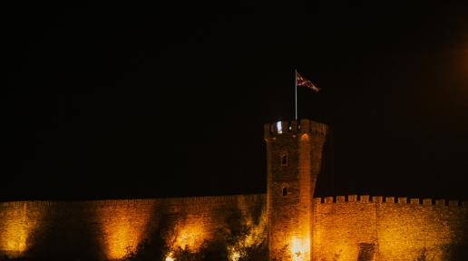 Skopje fortress illuminated in orange